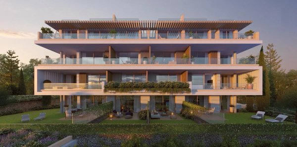 Modern appartementengebouw met 3 slaapkamers in Torremolinos met balkons en groenverlichting.
