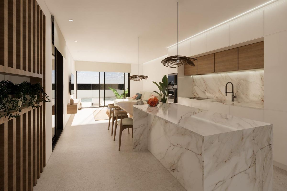 Moderne keuken met marmeren eiland en eetruimte, onderdeel van een stijlvol 3-slaapkamer huis in Dolores, Costa Blanca Zuid.