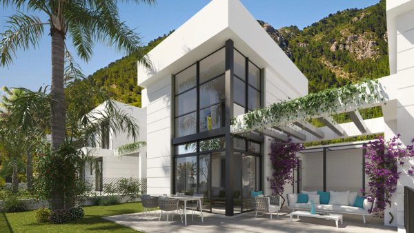 Moderne buitenkant van een 3-slaapkamer villa in Polop, met grote ramen en een aangelegde tuin.