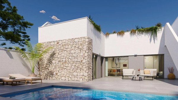 Stunning outdoor area of a modern townhouse in Pilar de La Horadada, featuring a pool and seating area.