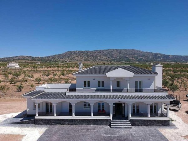 Aerial view of a 4-bed villa in Pinoso, featuring modern architecture and surrounding landscape.