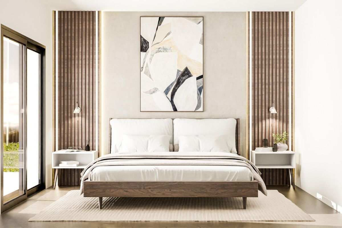 Stylish bedroom in a Pinoso villa, featuring modern decor, a large bed, and natural light.