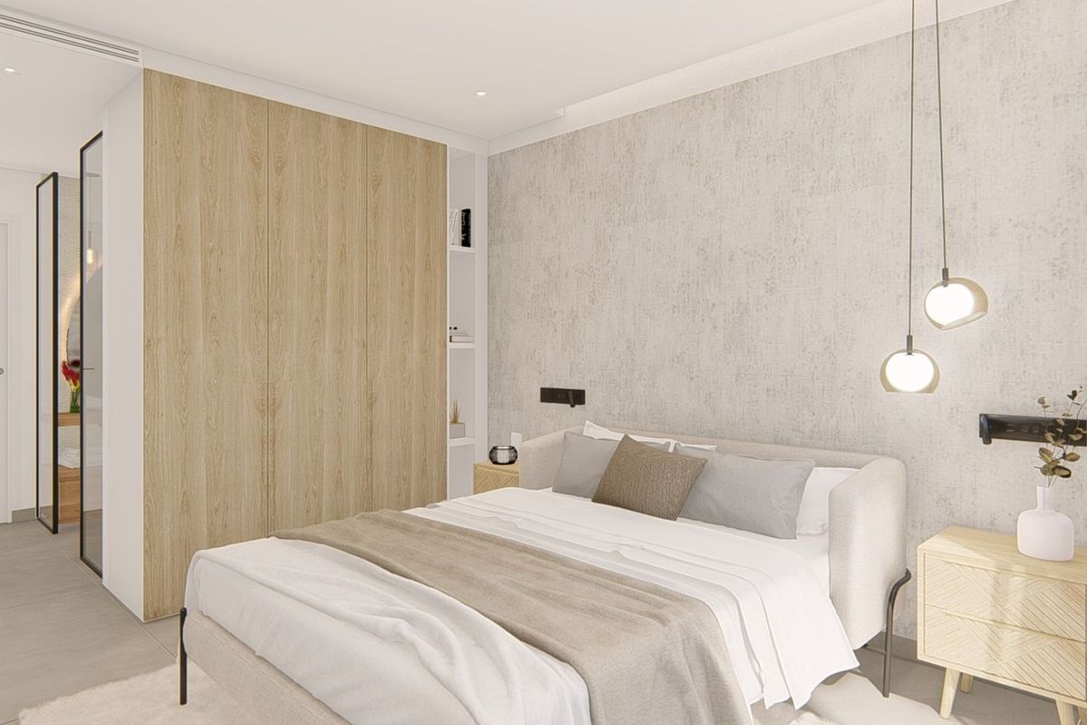 Modern secondary bedroom with soft lighting and tasteful decor in a Guardamar del Segura 3-bedroom apartment.