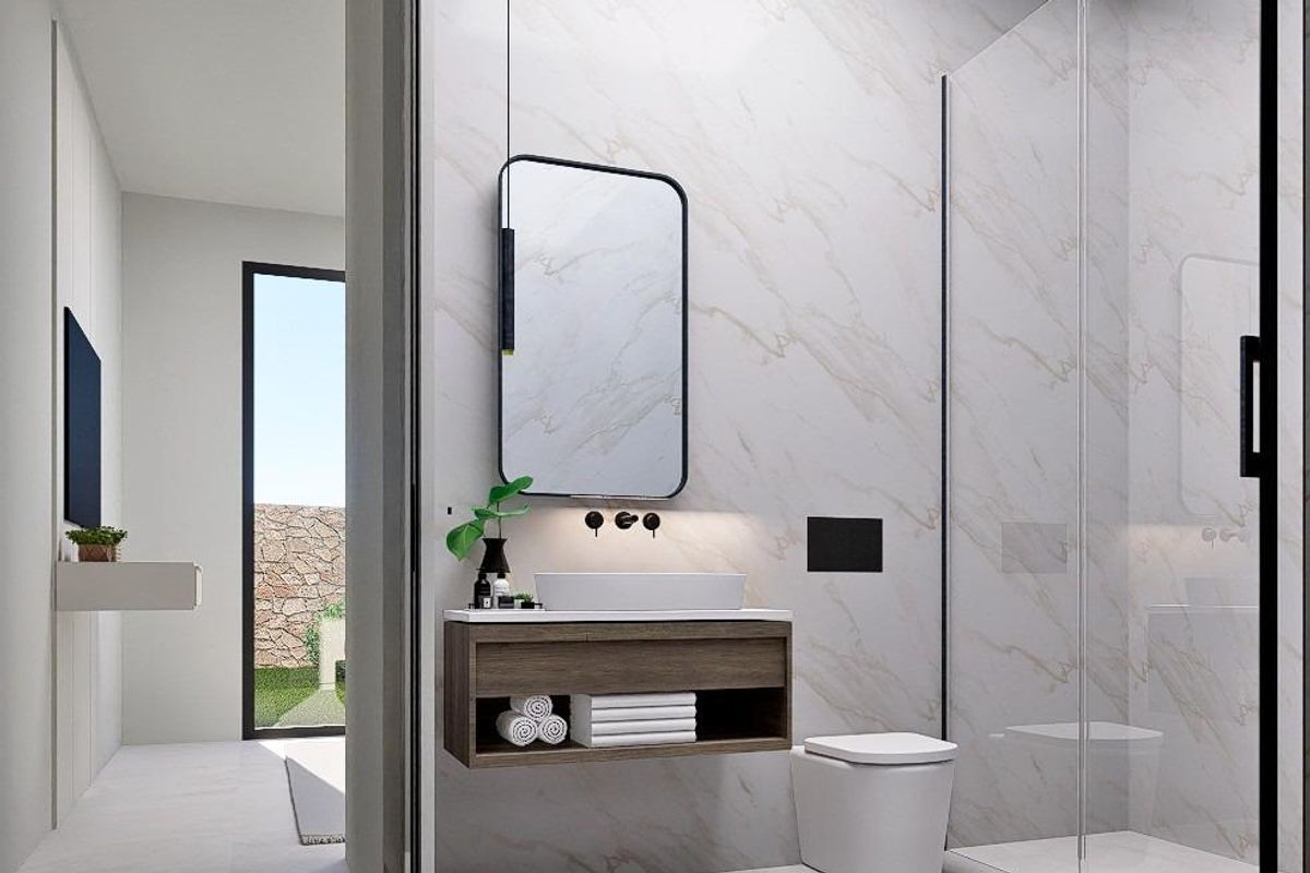 Moderne badkamer met een glazen douche en elegante armaturen in een 3-slaapkamer villa in Finestrat.