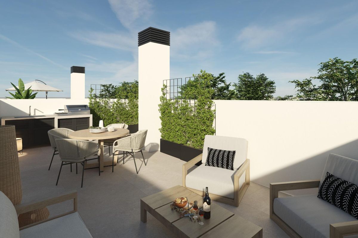 Rooftop terrace in a 3-bed townhouse in Dolores, Costa Blanca South. Includes outdoor kitchen and seating area.