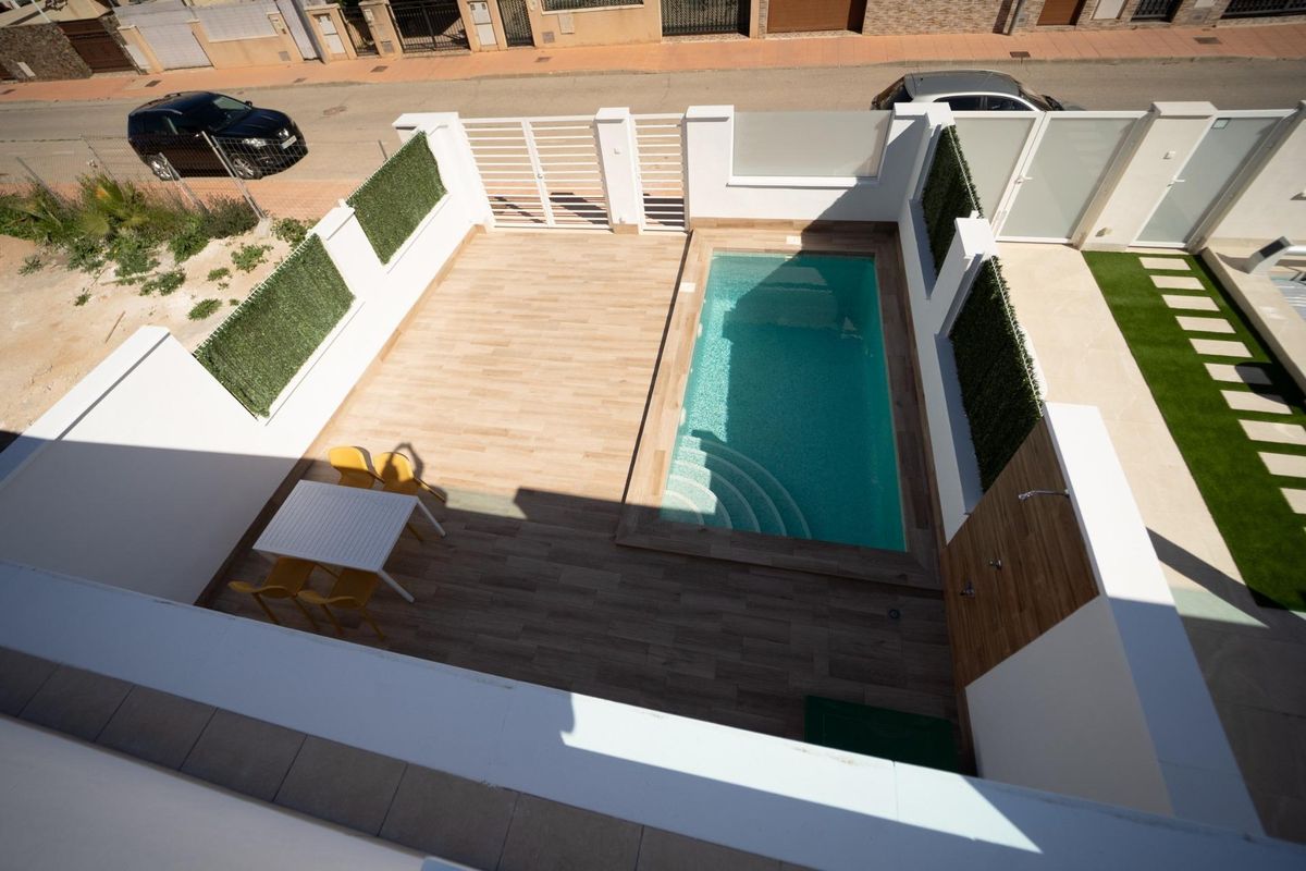 Aerial view of a 3-bed townhouse with a private pool and garden area in San Javier, Costa Calida, Spain.