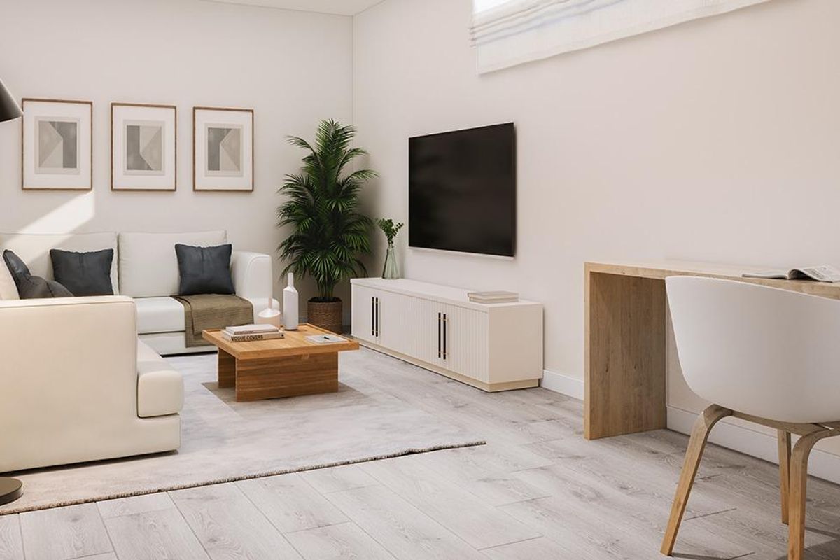 Gezellige woonruimte met een moderne bank en bureau, perfect voor ontspanning in een huis in San Juan.