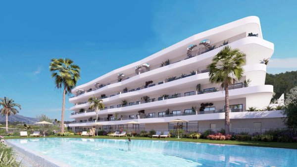 Modern appartementencomplex in La Nucia met palmbomen en zwembad, gelegen aan de Costa Blanca Noord.