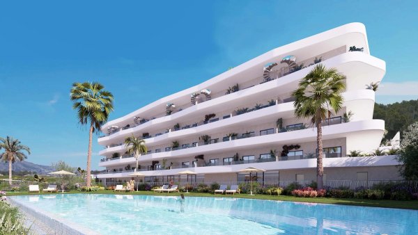 Modern appartementencomplex in La Nucia met palmbomen en zwembad, gelegen aan de Costa Blanca Noord.