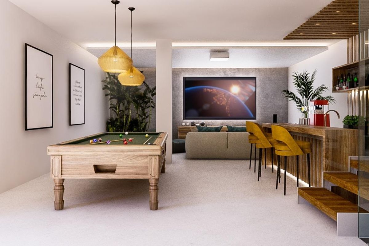 Moderne interieur met een speelkamer met biljarttafel en bar, ontworpen voor entertainment in een villa in Benahavís.