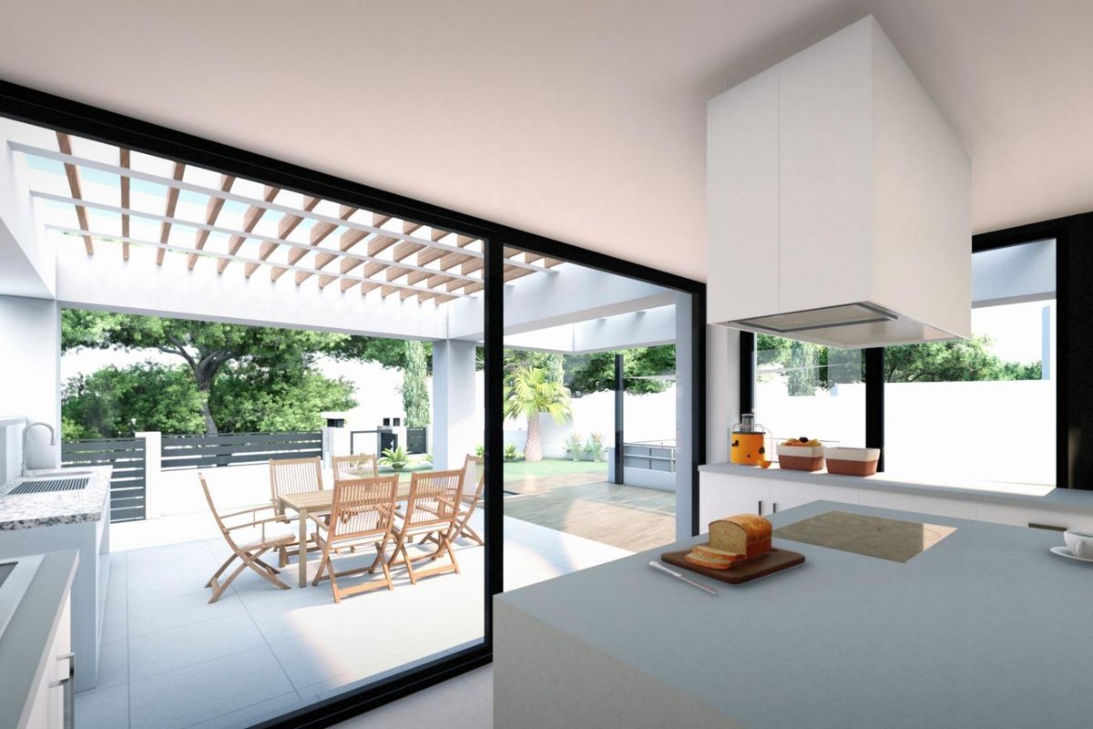 Stijlvolle keuken in de villa in Mijas, met een modern ontwerp en toegang tot een eetruimte buiten.