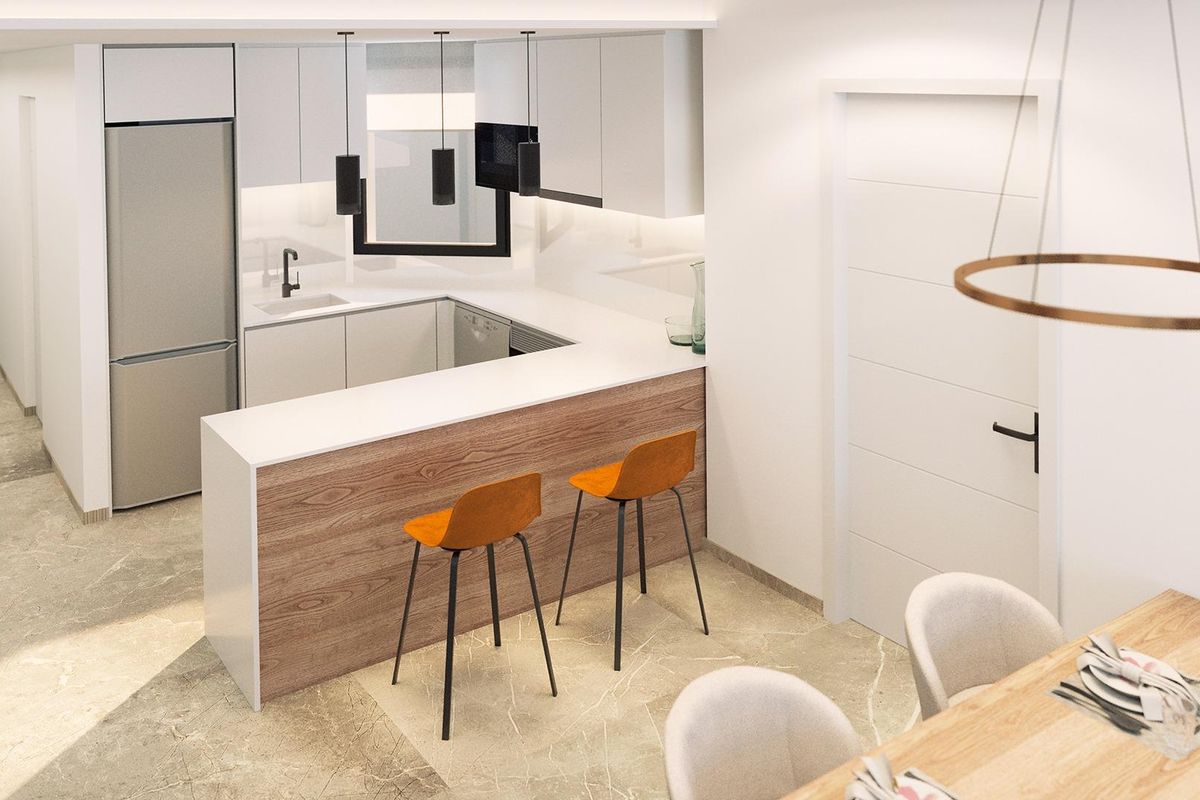 Contemporary keukenindeling met ontbijtbar en stijlvolle apparaten in het penthouse van Torrevieja.