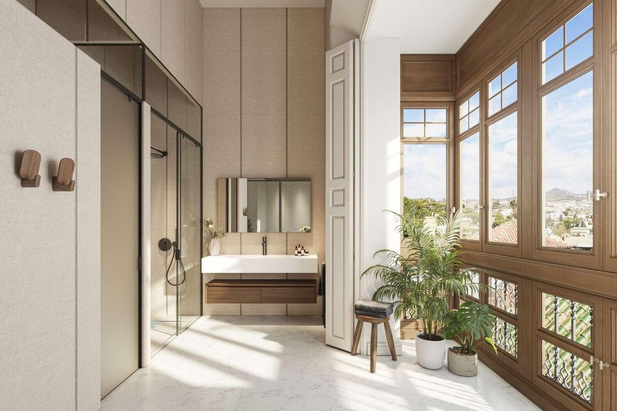 Heldere badkamer met moderne armaturen en grote ramen in een 3-slaapkamer appartement in Málaga, Costa del Sol.