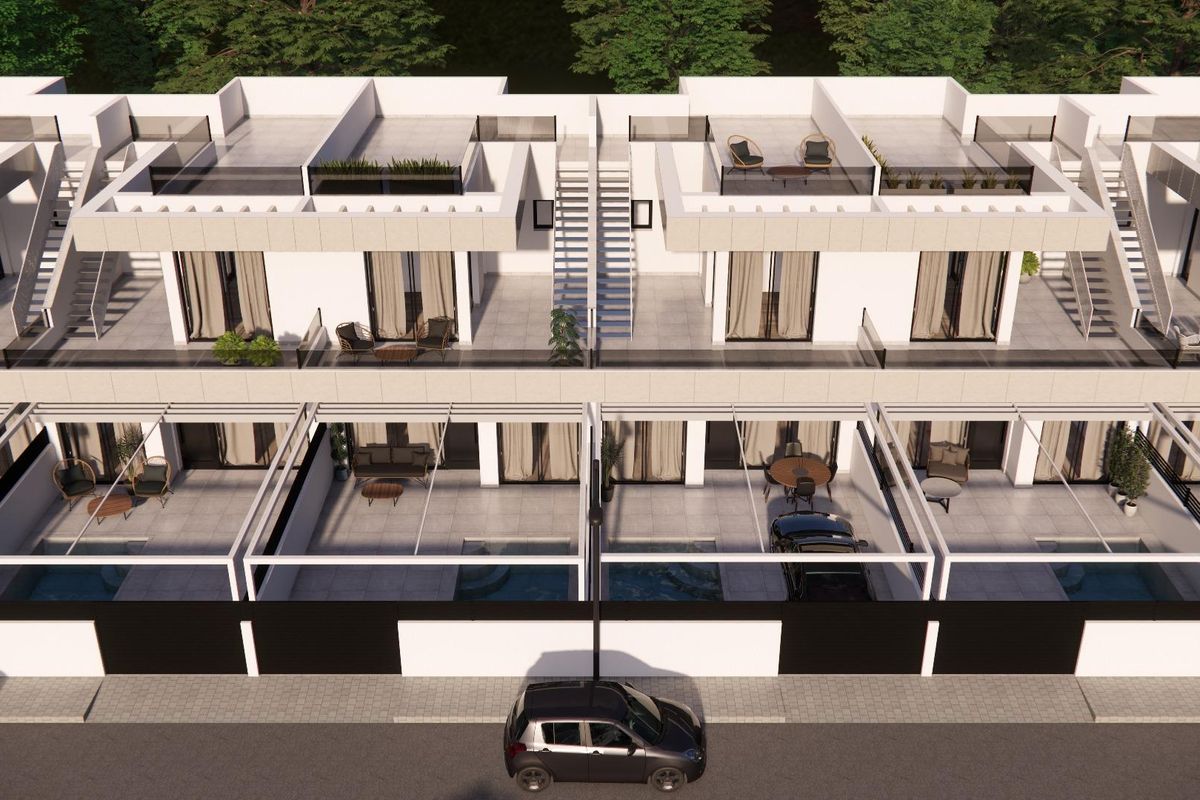 Luchtfoto van aaneengeschakelde herenhuizen in Rojales met buitenzitplaatsen en gemeenschappelijke ruimtes.