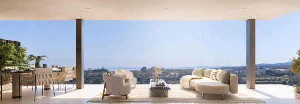 Stijlvol woongedeelte met panoramisch uitzicht vanaf het terras van deze penthouse in Estepona. 3 slaapkamers.