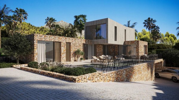 Moderne 4-slaapkamer villa in Jávea met unieke stenen gevel en buitenruimte onder een helderblauwe lucht.