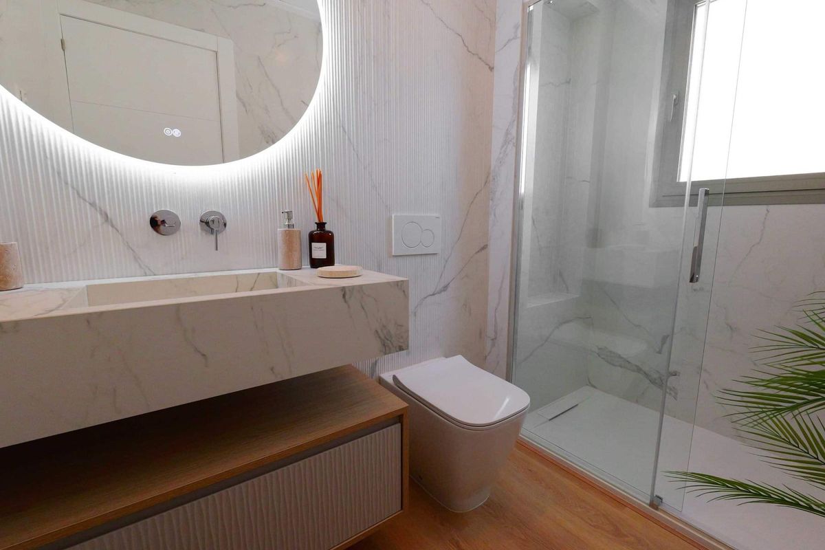 Stylish bathroom with marble features and modern fixtures in a 2-bed apartment, La Manga del Mar Menor.
