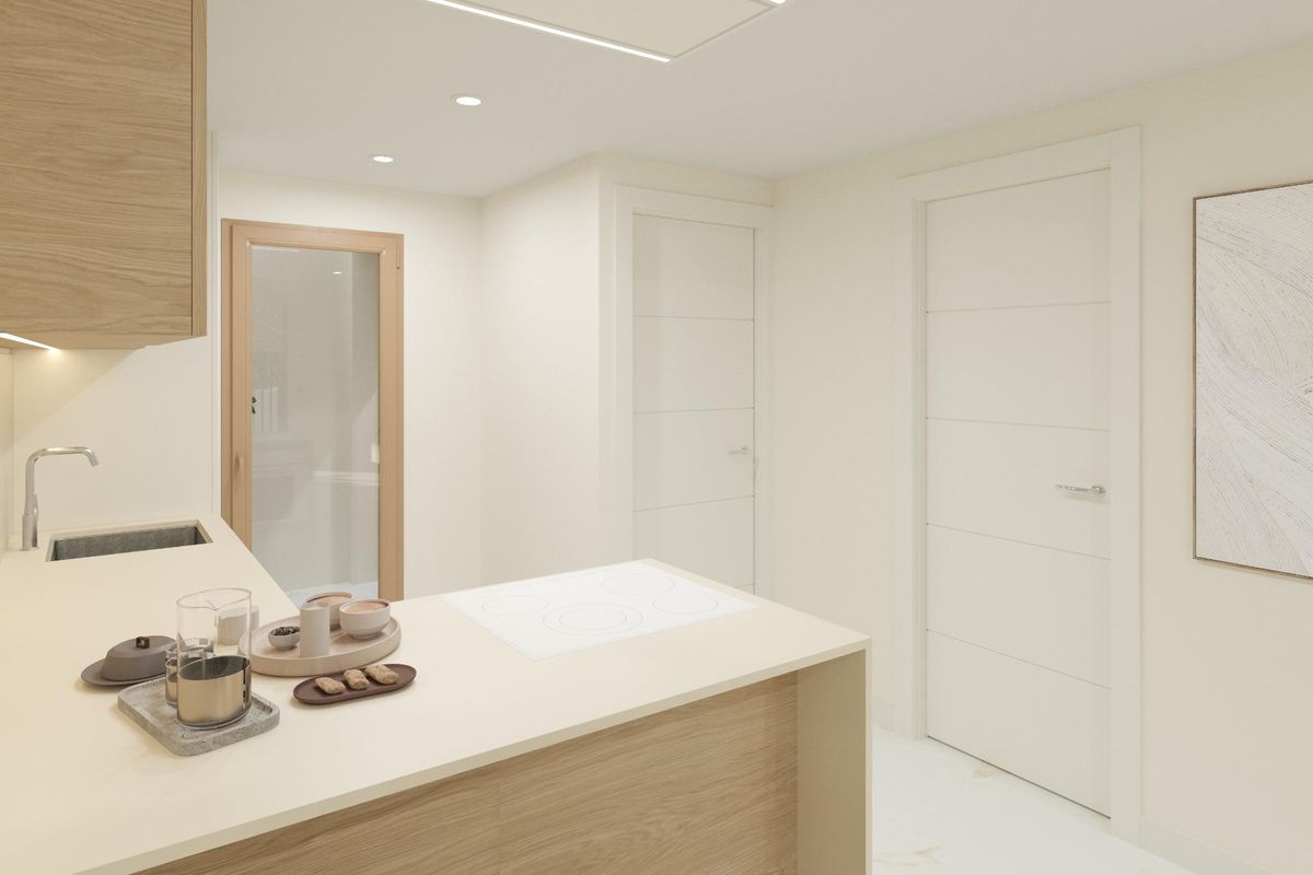 Modern kitchen in a 3-bed townhouse in Dolores, Costa Blanca South. Features a breakfast bar and neutral color palette.