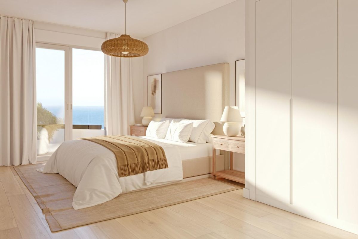 Bright bedroom in a 2-bed apartment, showcasing sea views from Calpe, Costa Blanca North.