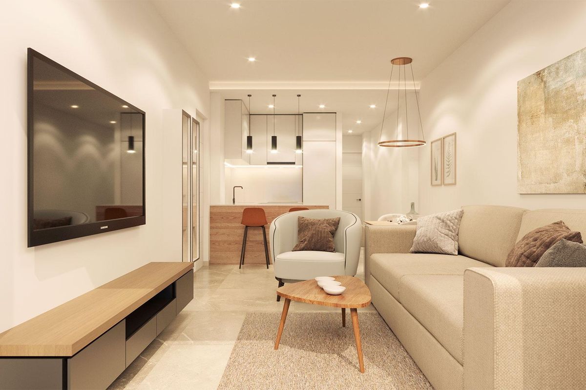 Gezellige woonkamer van een een-slaapkamer appartement in Torrevieja met moderne meubels en tv.