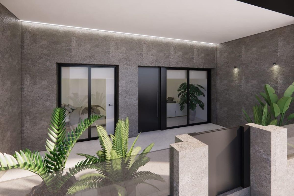 Een ander perspectief van de buitenkant van het appartement in Catral, met stijlvolle planten en modern architectuur.