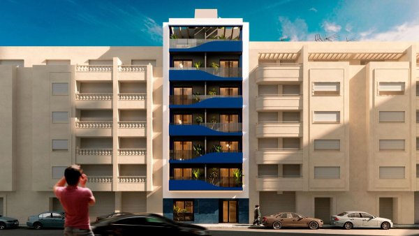 Moderne 1-slaapkamer appartementengebouw aan de buitenkant in Torrevieja, Costa Blanca met levendige blauwe accenten.