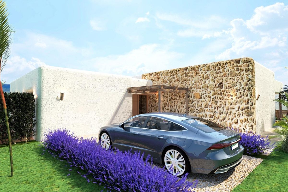 Voorkant van een stijlvolle 2-slaapkamer villa in Pinoso met parkeerplaats en aangelegde tuin.