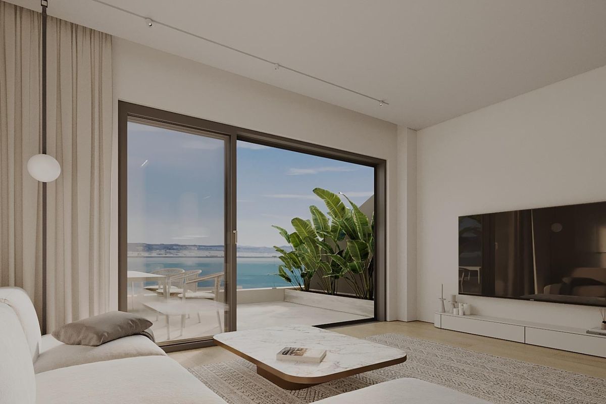 Heldere woonkamer met modern ontwerp en uitzicht op de oceaan in een 3-slaapkamer appartement in Mijas, Costa del Sol.