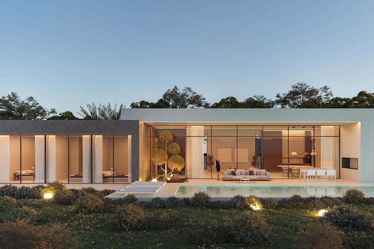 Prachtig uitzicht op de villa bij schemering in Calpe, met glazen elementen en aangelegde tuinen.