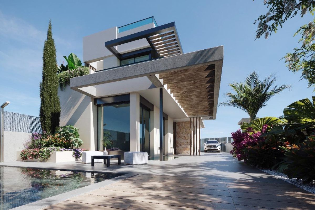 Moderne 3-slaapkamer villa in Los Alcazares, met een stijlvolle ingang en weelderige tropische planten.