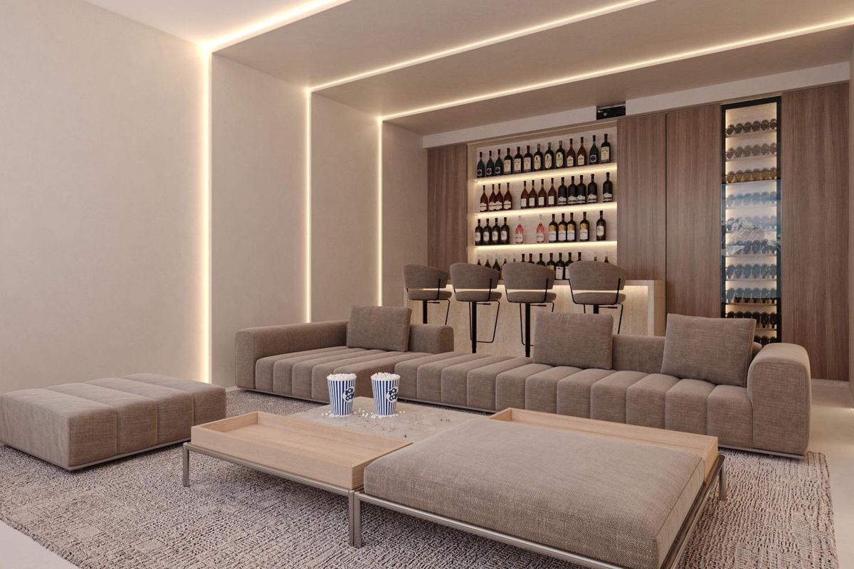 Chique woonkamer met een ruime lounge en bar, perfect voor ontspanning in een villa in Mijas.