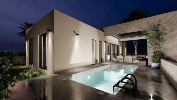 Modern villa exterior with pool at night in Baños y Mendigo, Costa Calida. Relaxed outdoor seating.