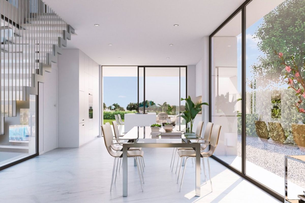 Dining area in a 4-bed villa in Baños y Mendigo, featuring sleek design and views of the garden.