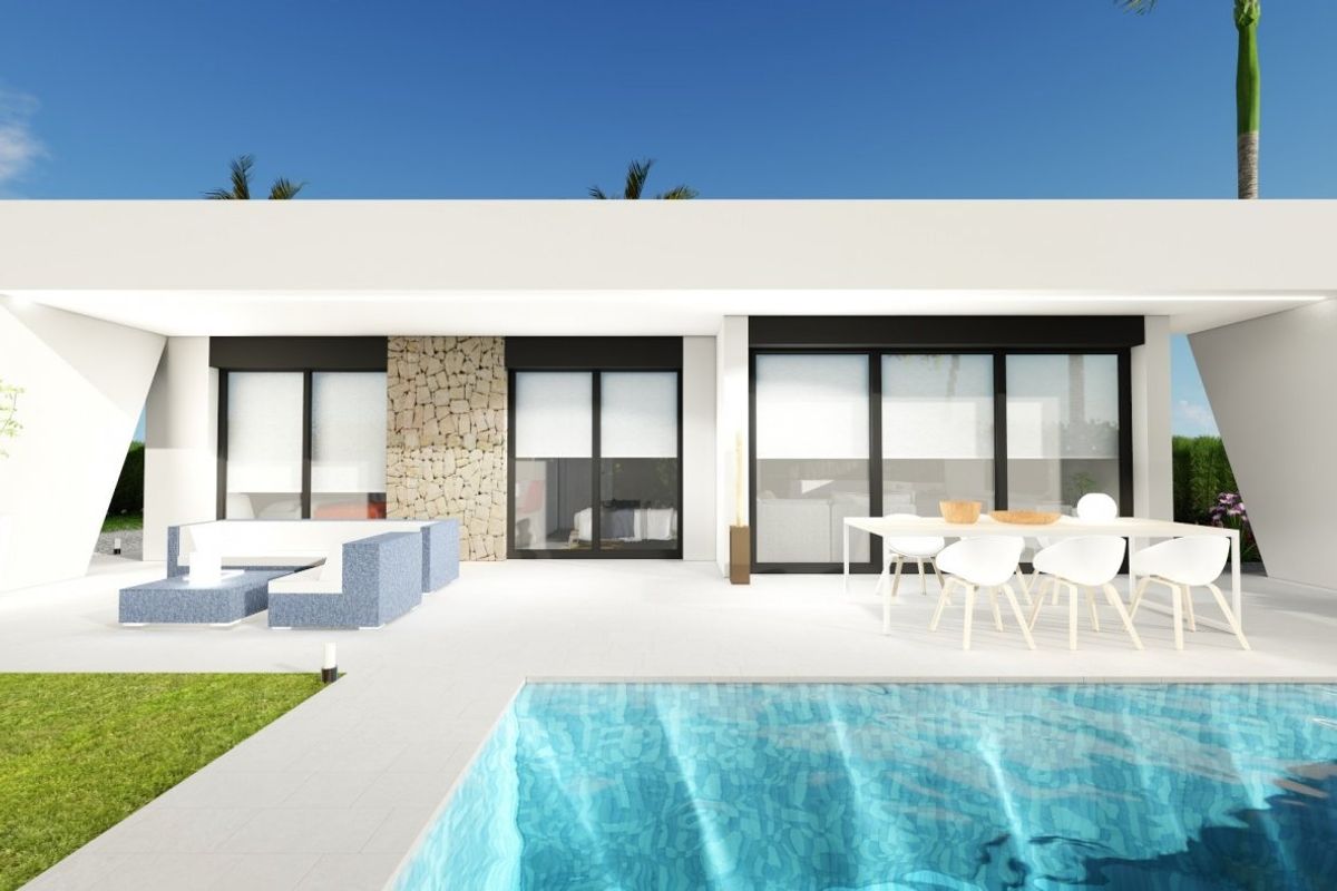 Modern exterior view of a 2-bed villa in Calasparra, with a pool and garden.