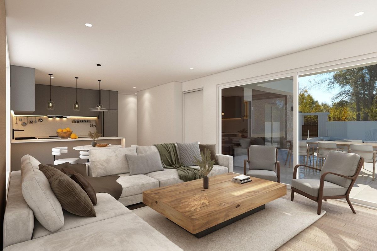 Stijlvolle woonkamer van een 3-slaapkamer villa met een grote bank en open keuken in Ciudad Quesada, Costa Blanca Zuid.