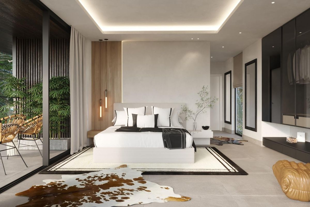 Comfortabele en stijlvolle slaapkamer met moderne meubels en uitzicht op buiten in een villa gelegen in Benalmádena.
