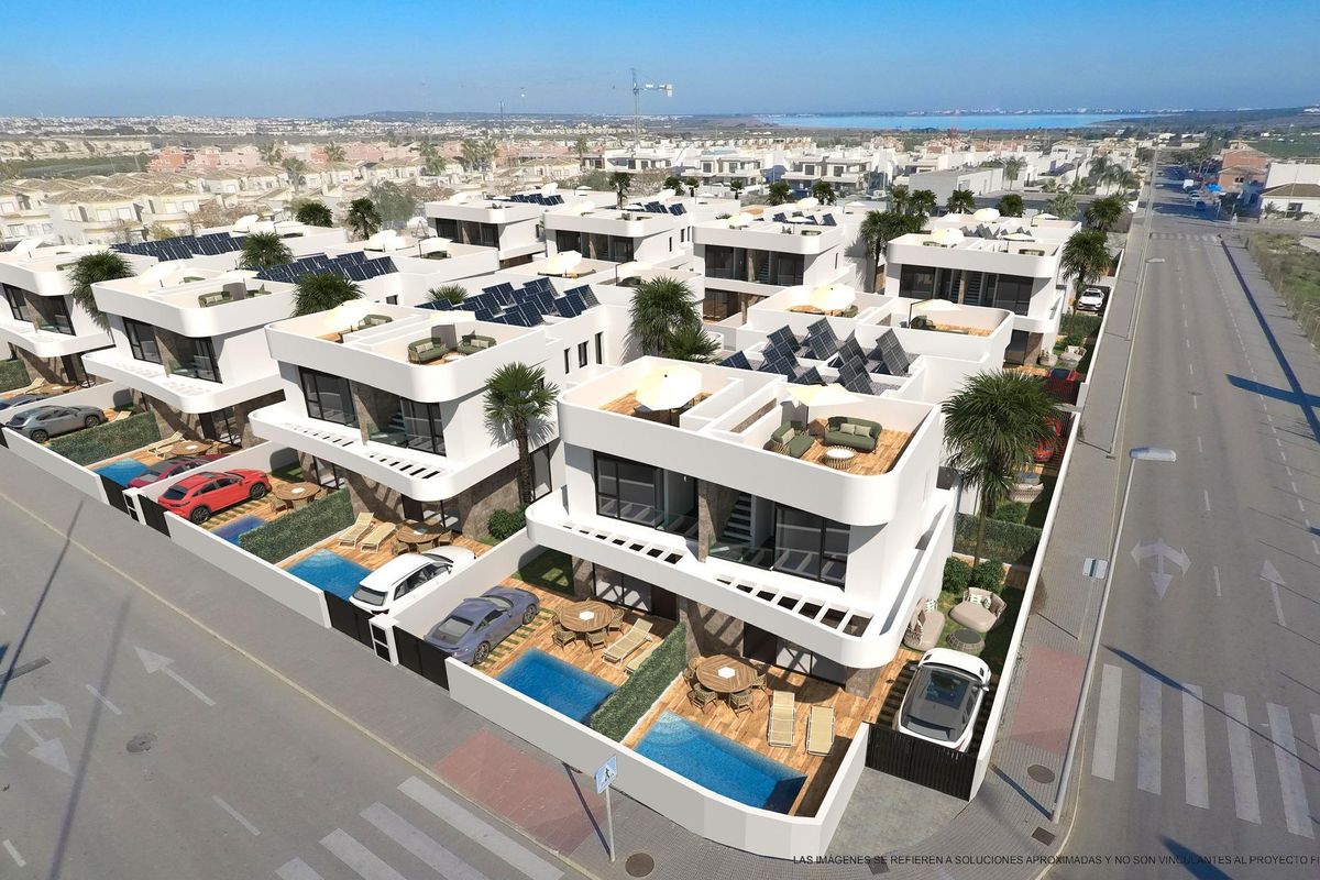 Luchtfoto van moderne villa's met zwembaden in Los Montesinos, die de levendige woongemeenschap toont.