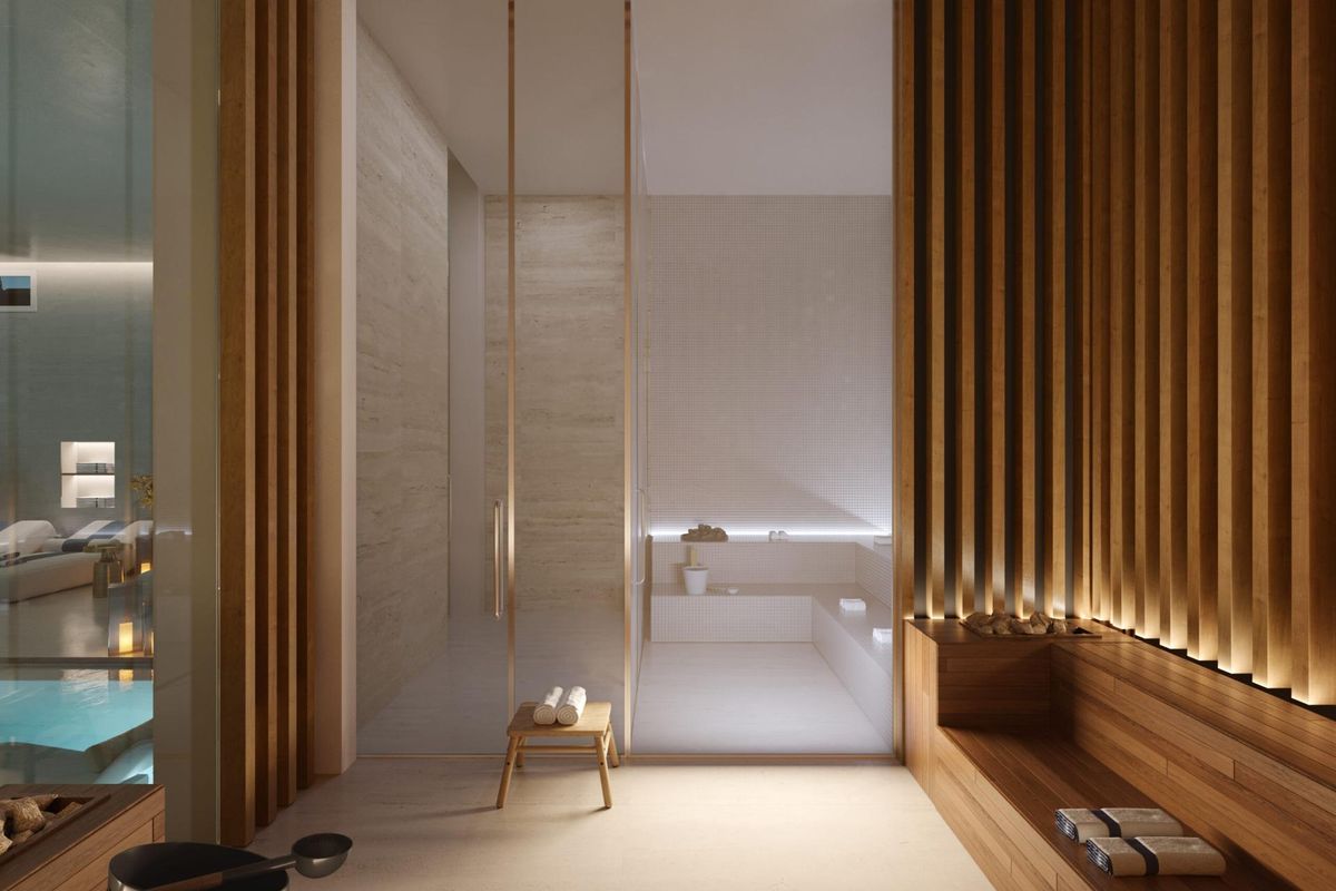 Ontspannen spagebied met houten details en een douche, onderdeel van een luxe vierbedpenthouse in Marbella.