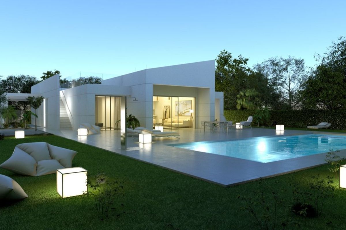 Elegant villa in Baños y Mendigo with illuminated gardens and pool area, perfect for evening relaxation.
