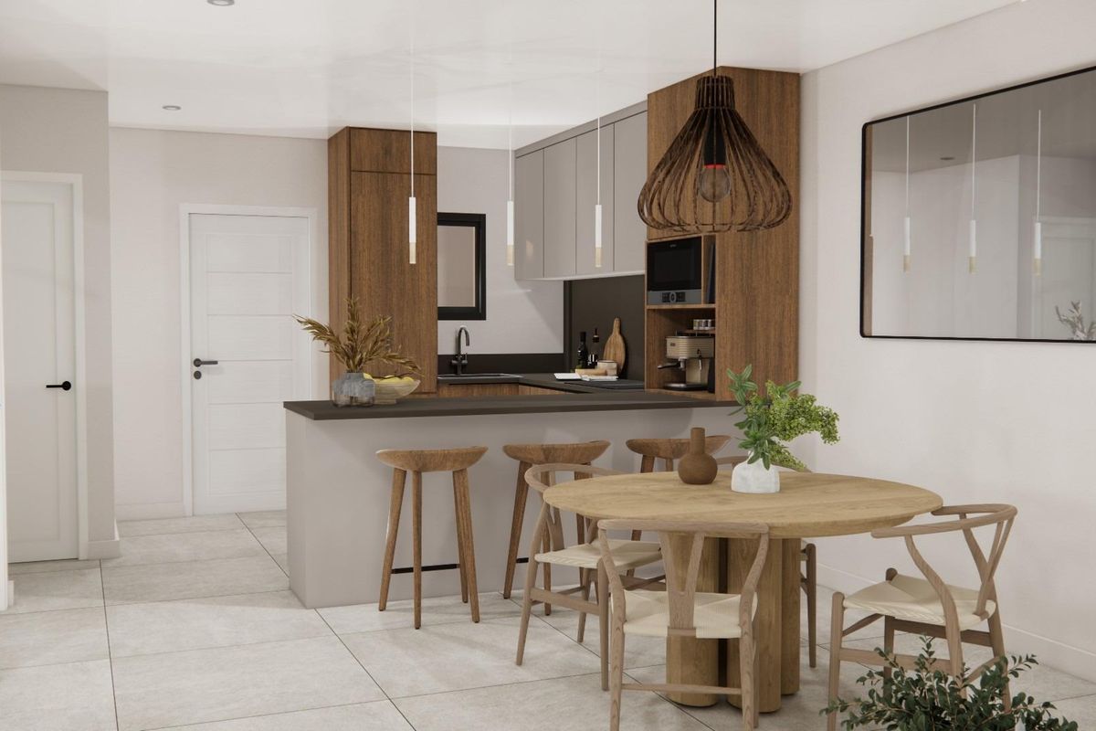 Eigentijdse keuken met houten barkrukken, rond eetkamertafel en elegante hanglamp in appartement in Rojales