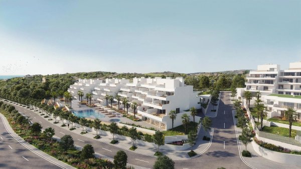 Buitenaanzicht van modern appartementencomplex met zwembad in Estepona, Costa del Sol.