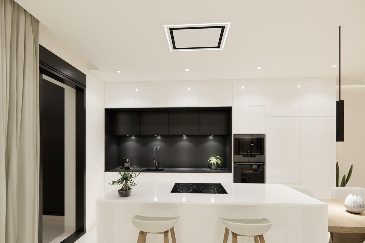 Strakke keukenontwerpen met zwarte kasten en natuurlijk licht in de bungalow in Dolores.