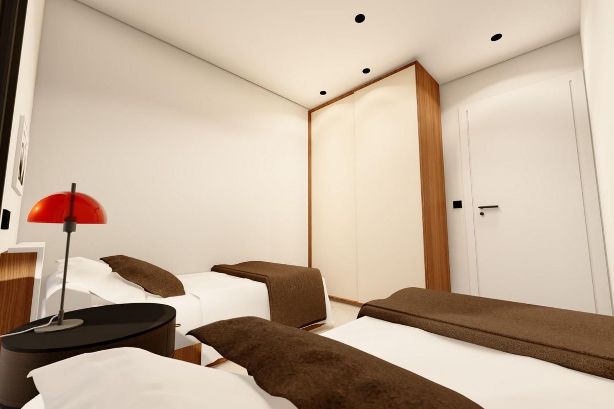 Interieur van een slaapkamer met twee bedden met een eenvoudig en modern ontwerp in een villa in Benijofar.