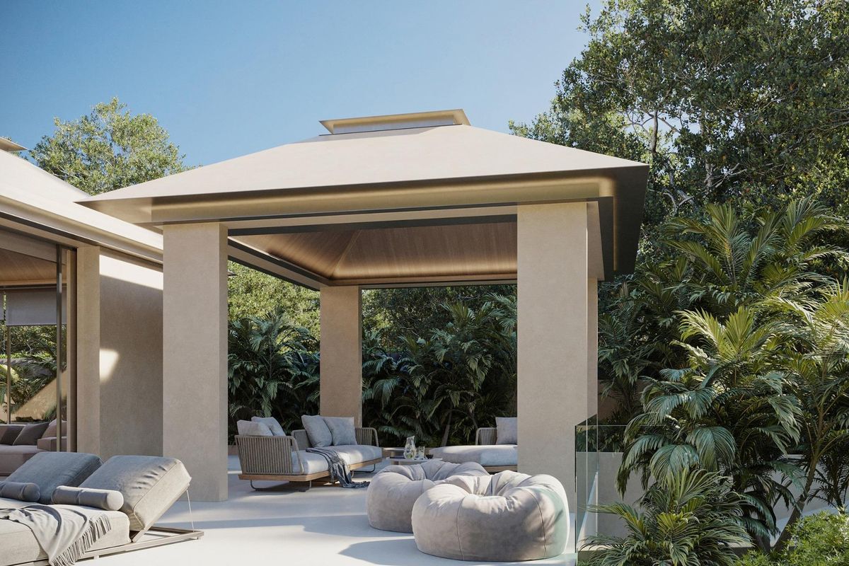 Elegant buitenpaviljoen met loungezitplaatsen omgeven door groen in een villa in Marbella.