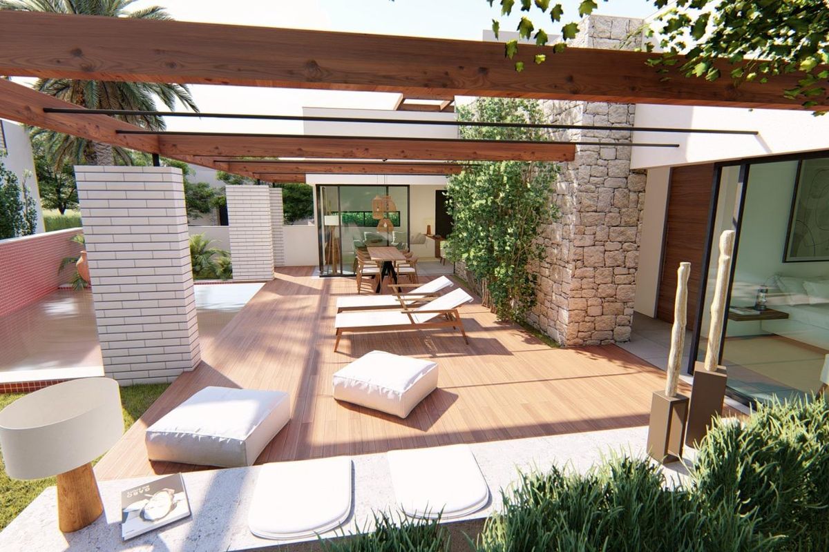 Ontspanningsruimte van een villa in Torre Pacheco met ligstoelen en uitzicht op de tuin en het zwembad.