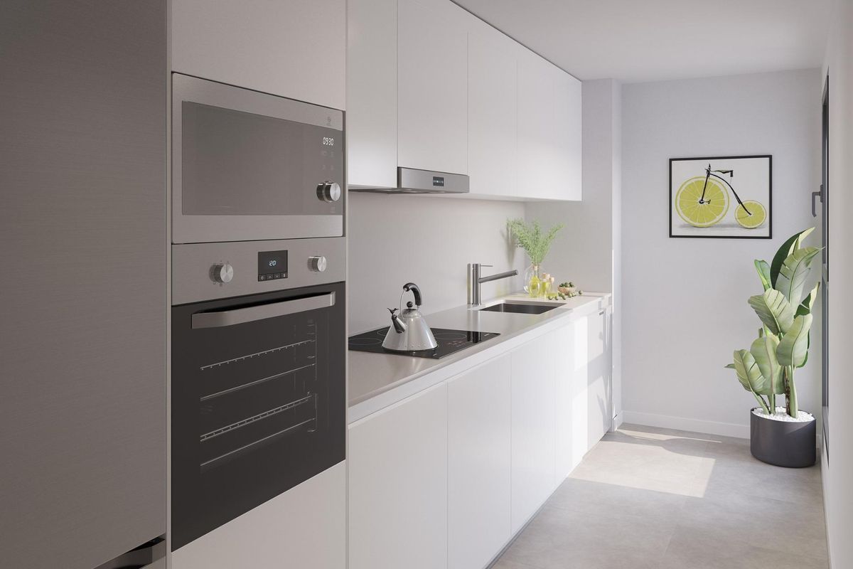 Contemporary keuken in een 3-slaapkamer appartement in Mijas, met moderne apparaten en strakke kasten.