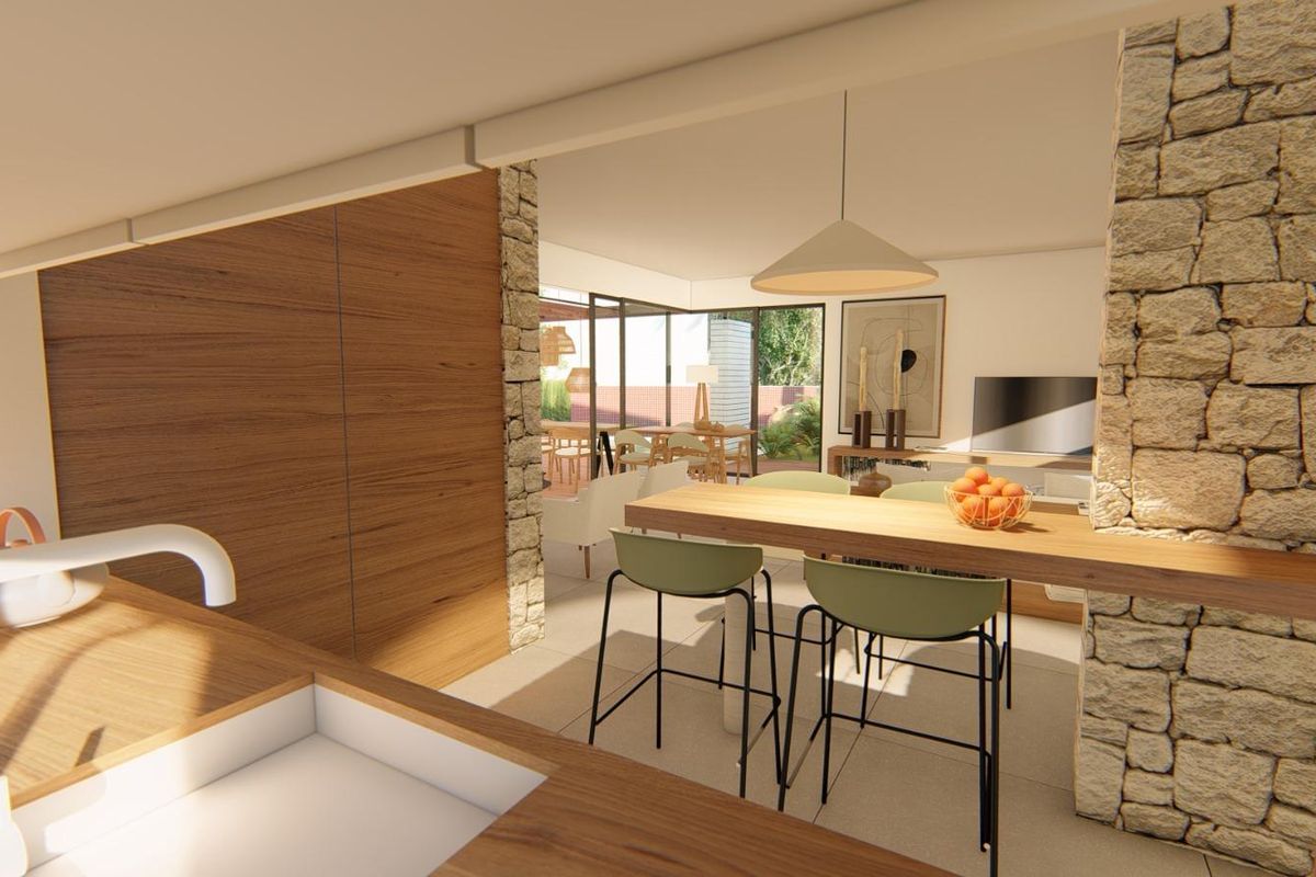 Moderne keuken met stenen accenten en een gezellige ontbijthoek, verbindt zich met de eetruimte in Torre Pacheco villa.