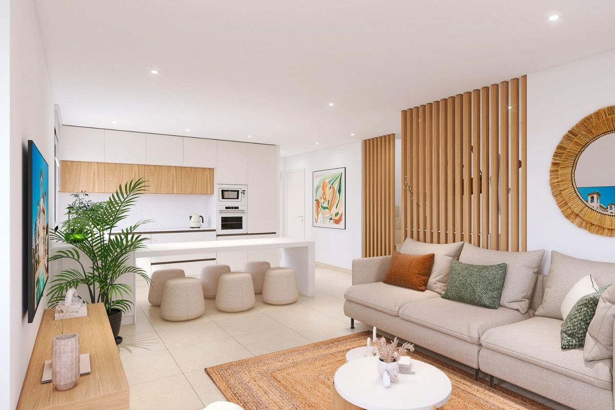 Heldere binnenkant van de woonkamer in een 4-slaapkamer bungalow in Bigastro, met moderne decoratie en een keuken.