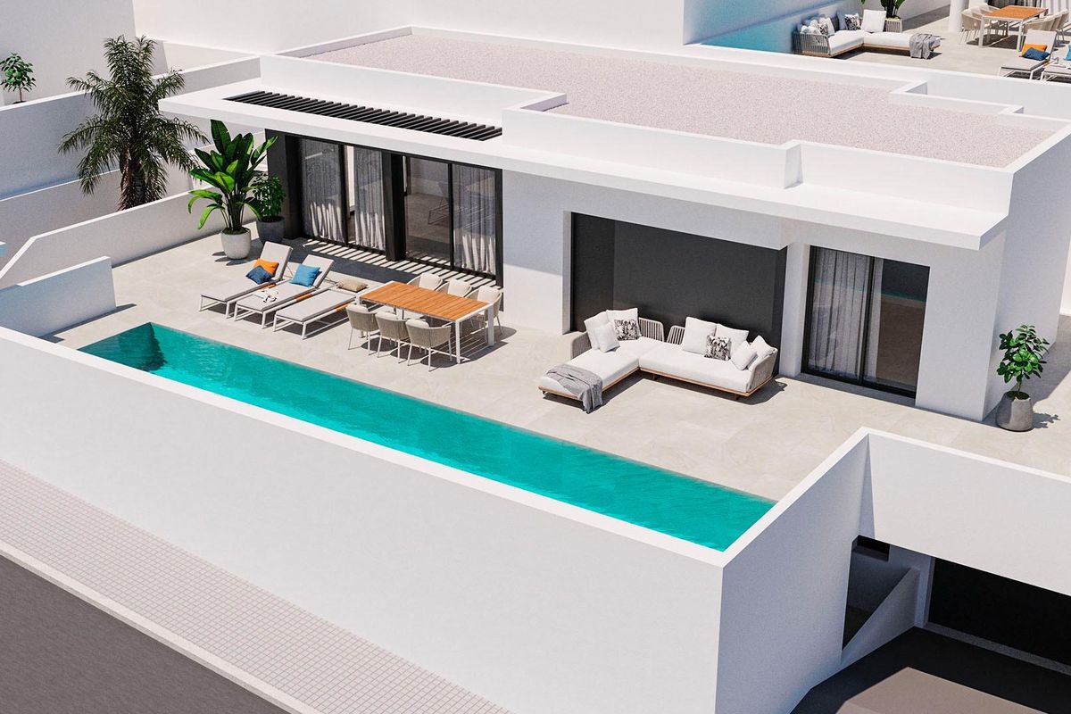 Een andere luchtfoto van de stijlvolle villa in Rojales met 5 slaapkamers, met de zwemruimte en eetgedeelte in beeld.