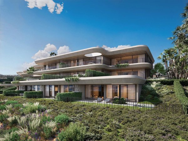 Modern appartementengebouw met 3 slaapkamers in Casares, Costa del Sol, omringd door aangelegde tuinen.